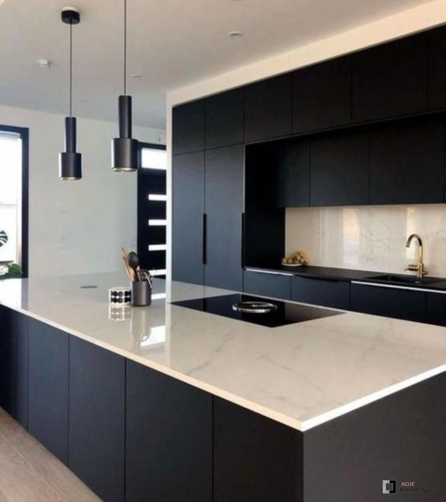 Black face-frame cabinetry with gold hardware