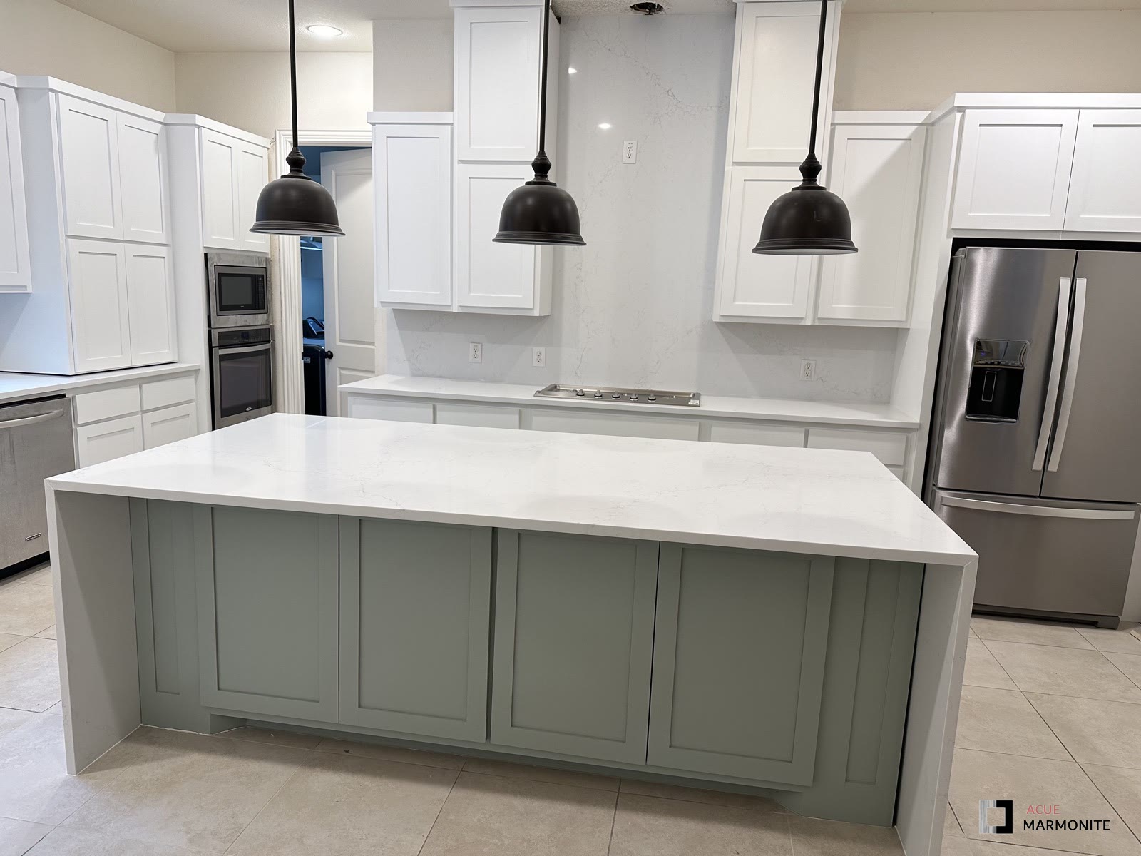 Quartz waterfall island with sage cabinetry