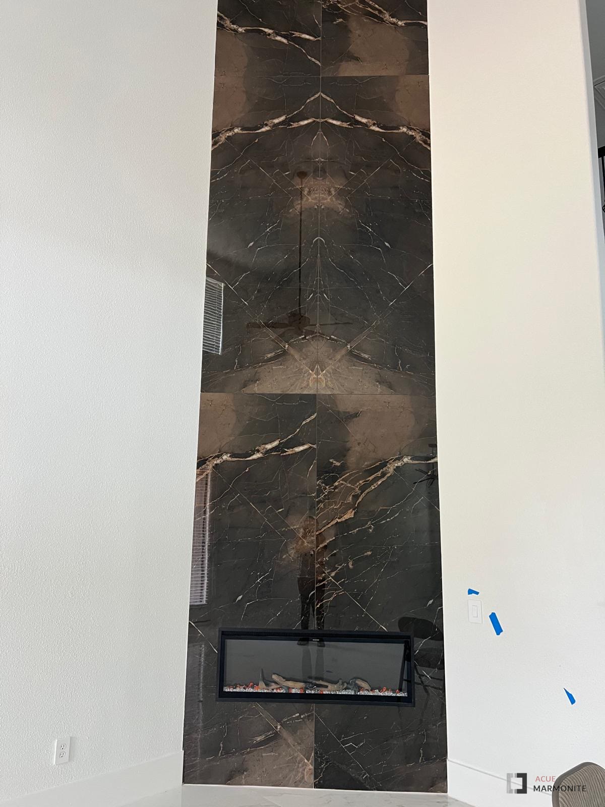 Meridiana Marron dark book-matched fireplace wall, installed by Acue Marmonite