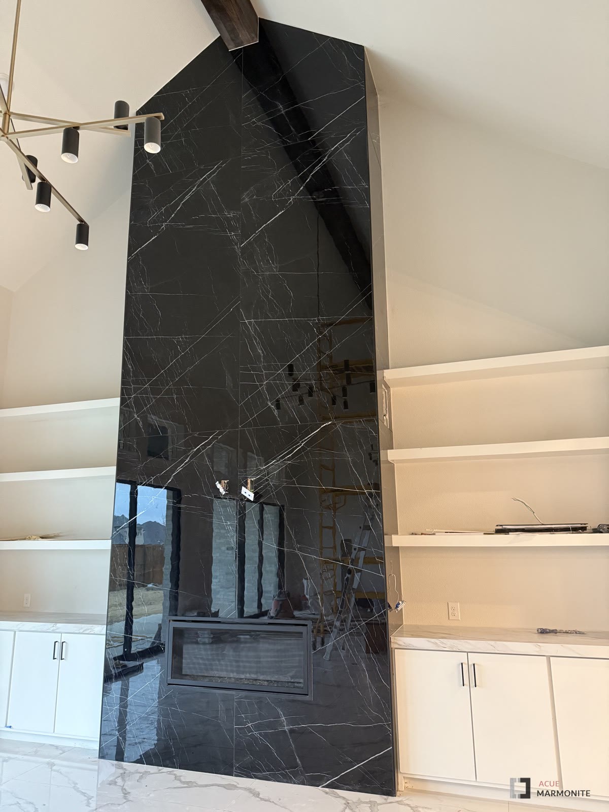 Nero Midnight fireplace surround, installed by Acue Marmonite
