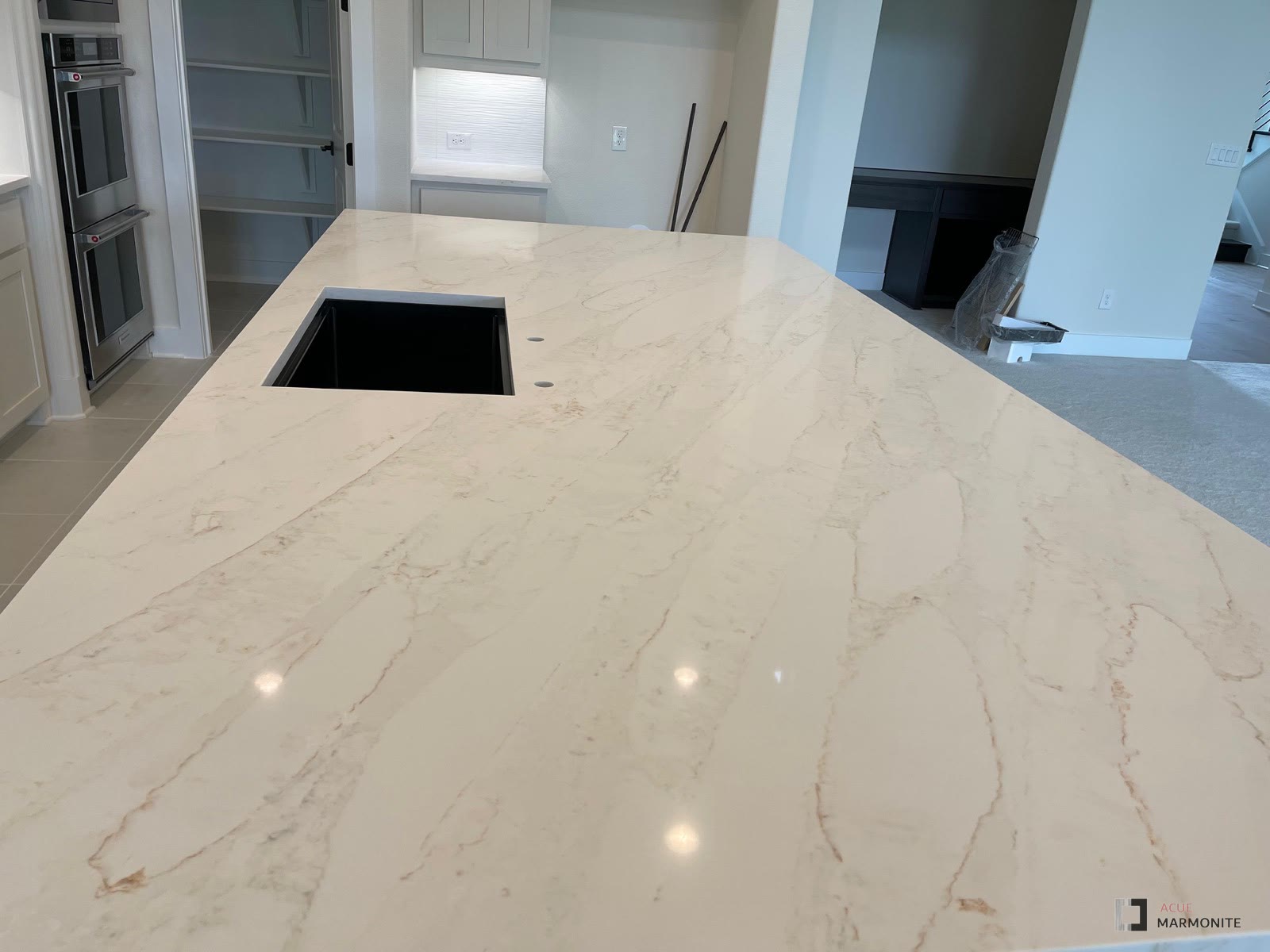 Calacatta Vesta quartz island, installed by Acue Marmonite
