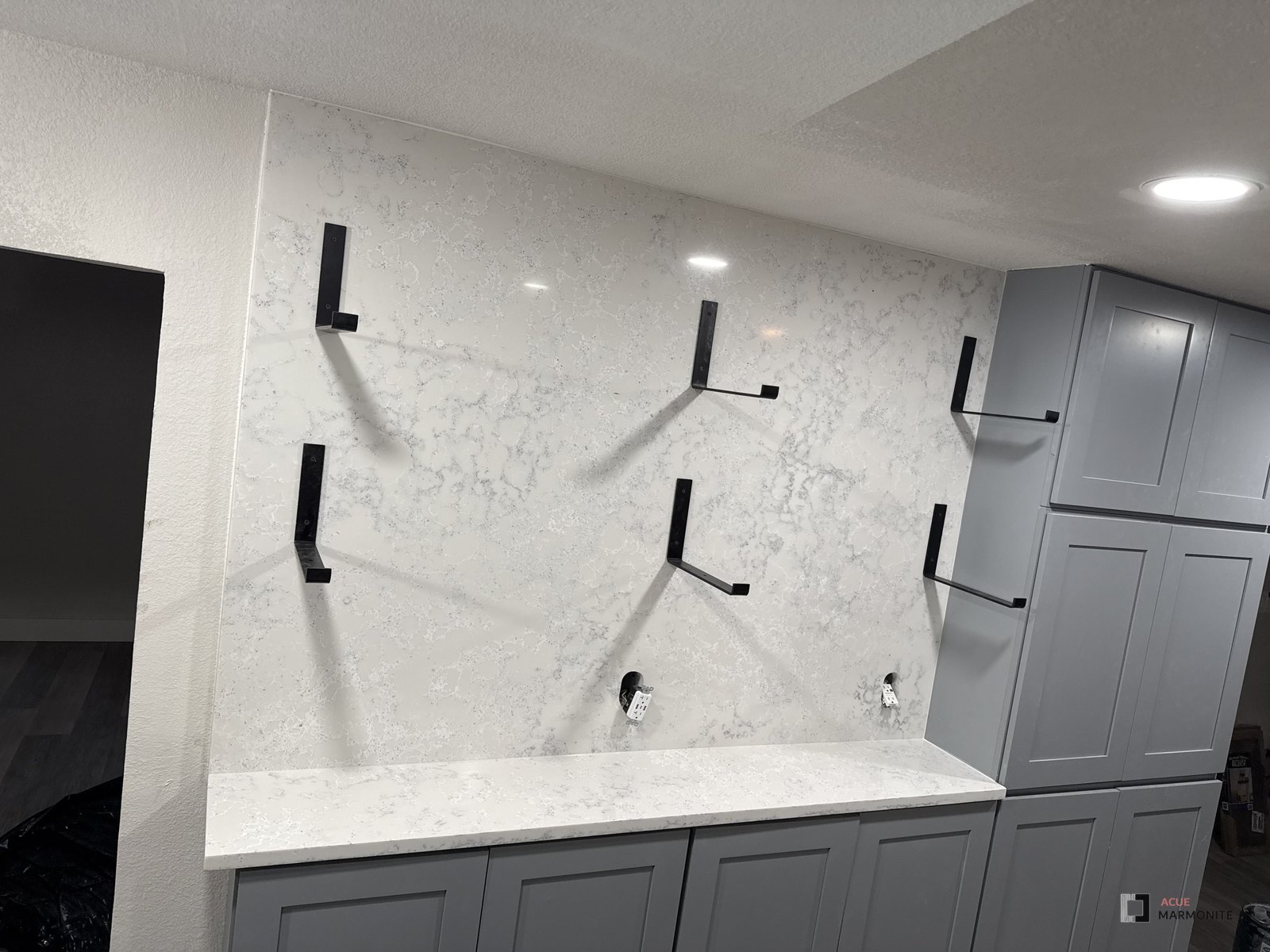 Charleston Seaboard quartz countertop with full-height slab backsplash in Fort Worth, TX, installed by Acue Marmonite