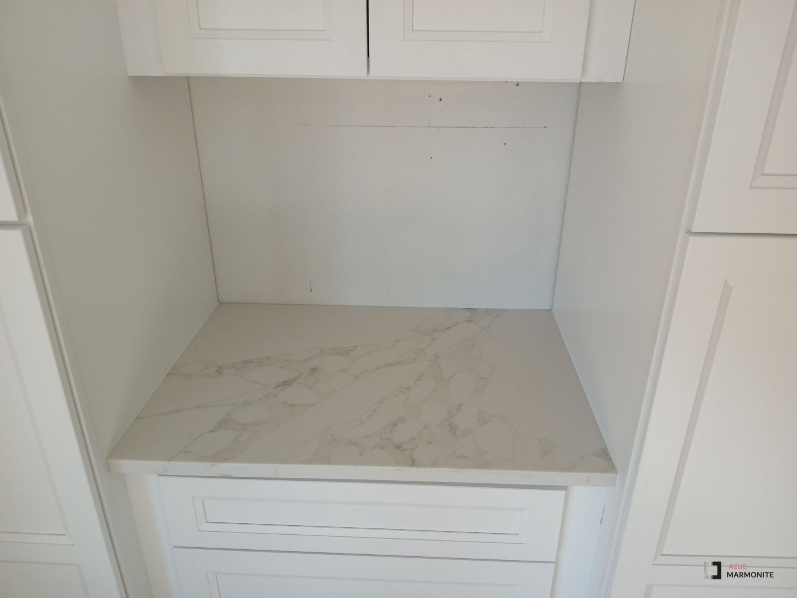 Lumix quartz countertop in a white built-in cabinet nook, installed by Acue Marmonite