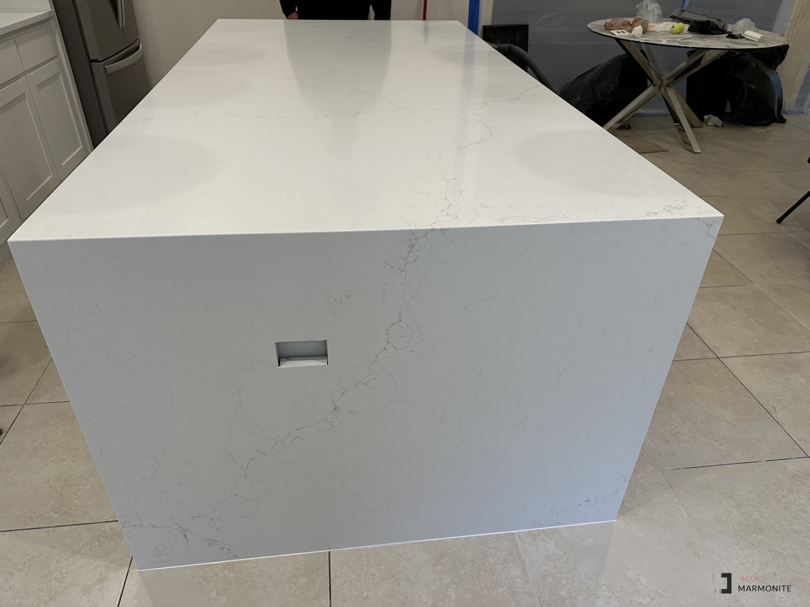 White quartz waterfall island with undermount sink, installed by Acue Marmonite
