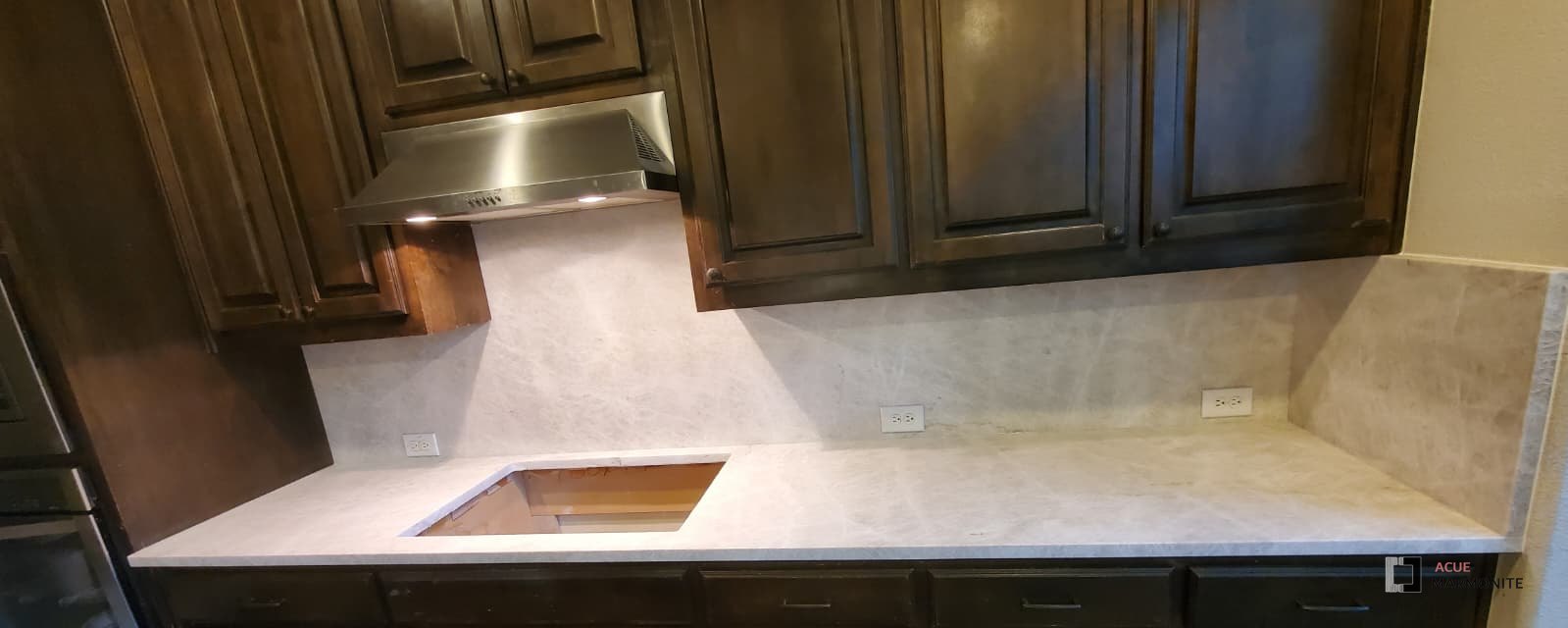 Taj Mahal quartzite, honed finish, kitchen countertop with full-height backsplash in Carrollton, TX, installed by Acue Marmonite