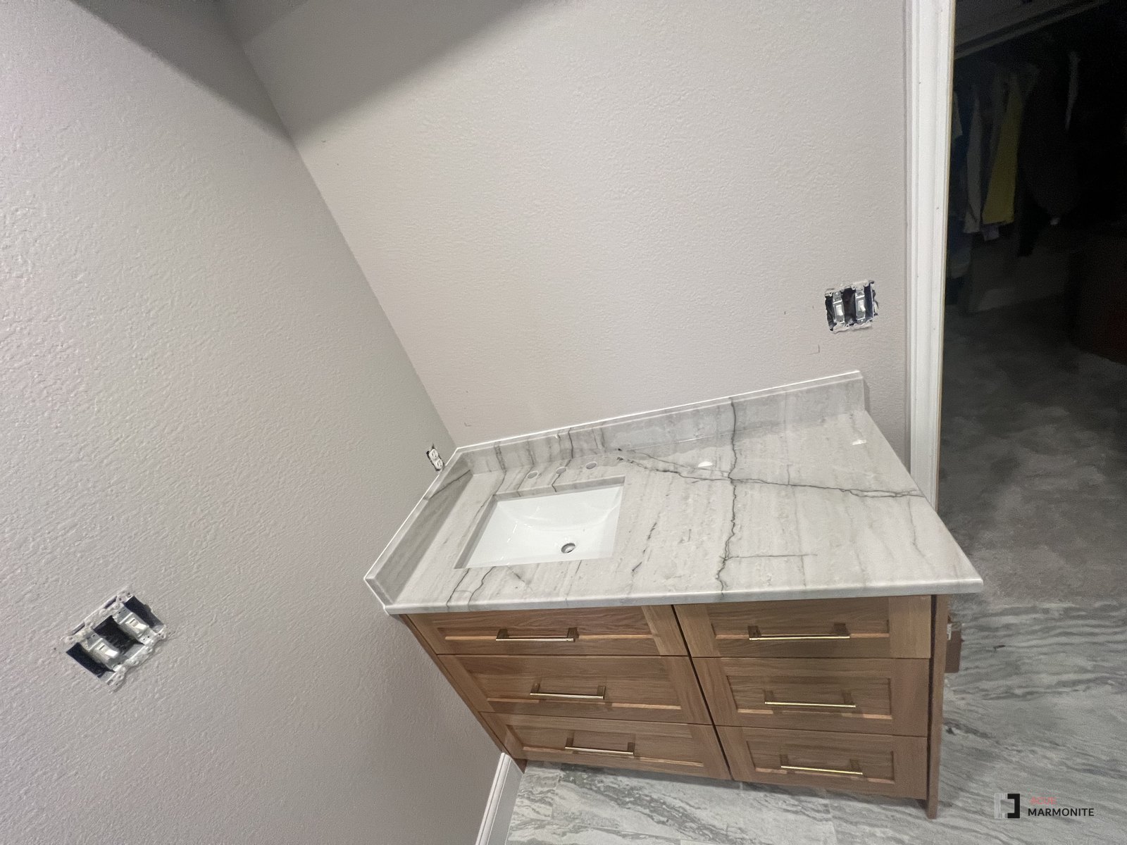 White Pearl quartzite bathroom vanity top with undermount sink, installed by Acue Marmonite