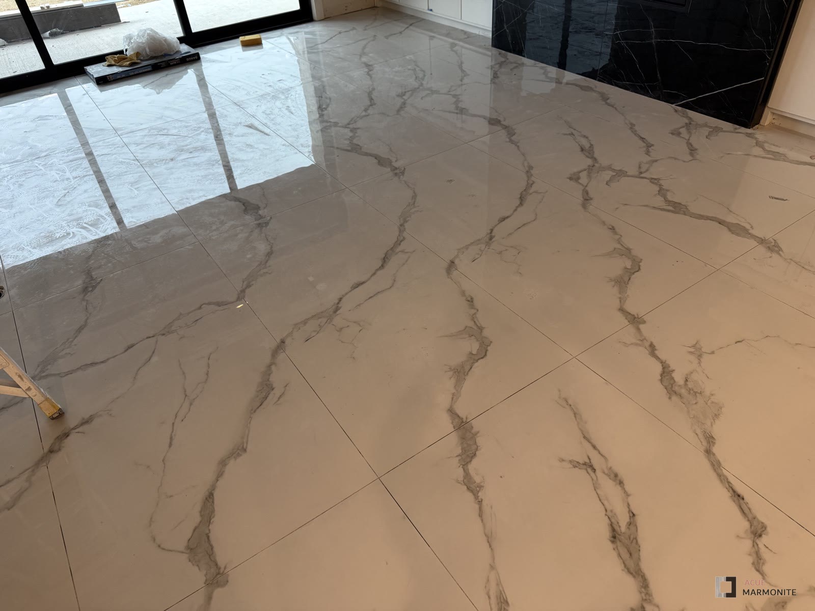 Brilliant Statuario tile flooring installed by Acue Marmonite