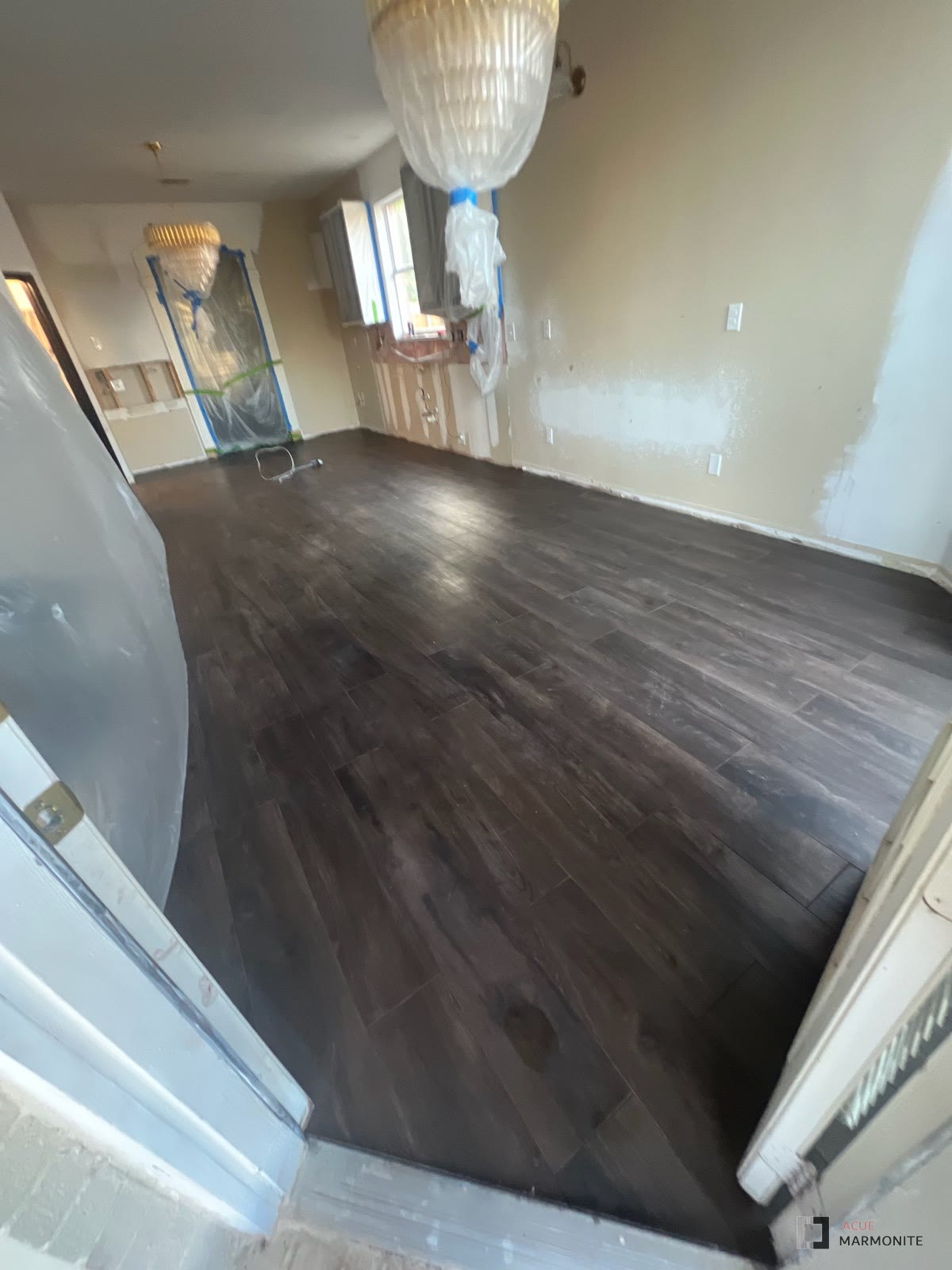 Wood-look vinyl plank flooring installed by Acue Marmonite
